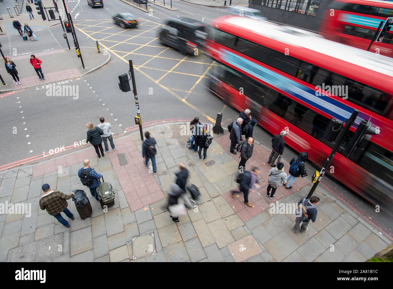 London, United Kingdom - November 5, 2019: People moving in all directions outside St. Pancras Station on a cloudy day. Stock Photo