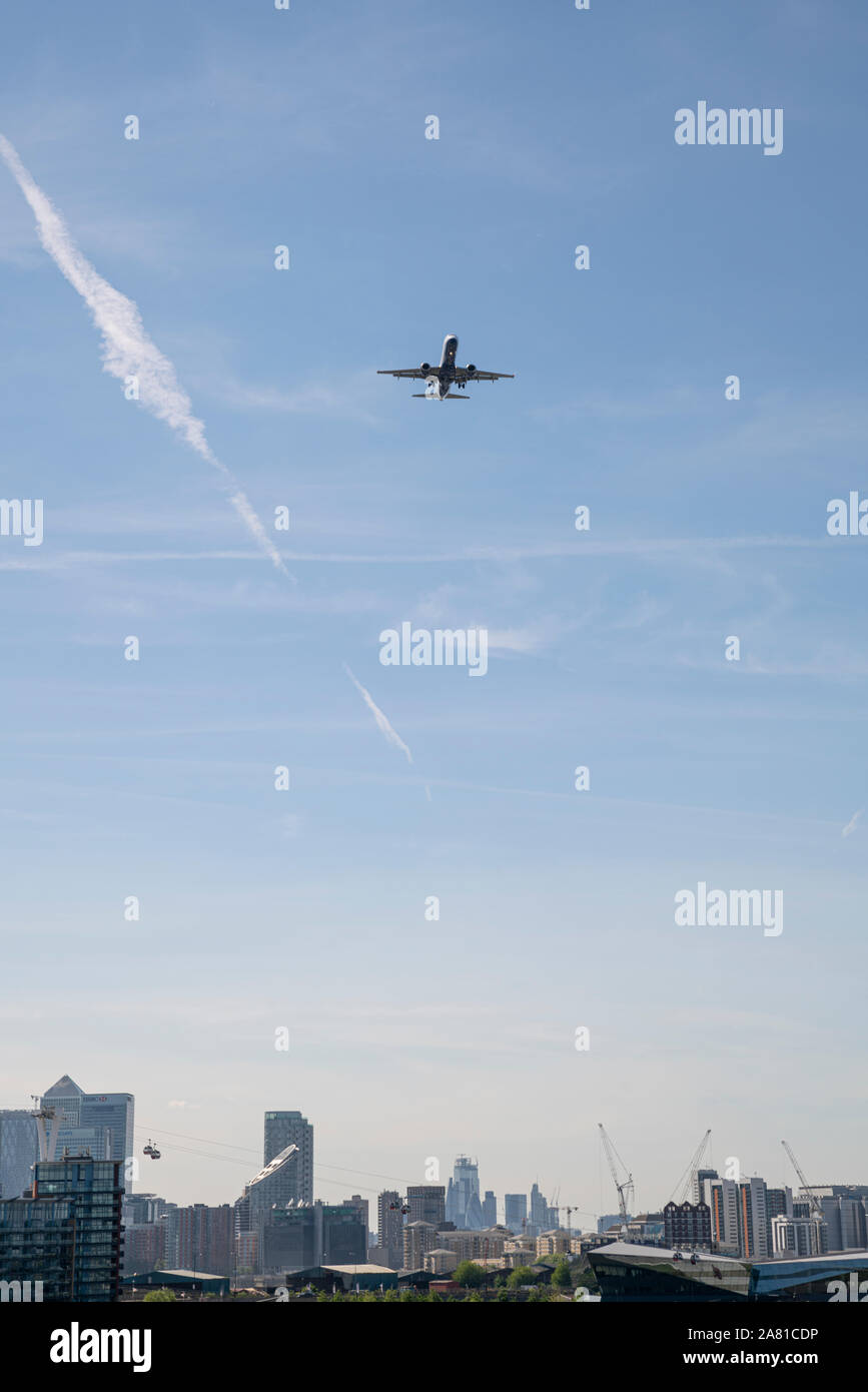 Planes flying over the city of London, England Stock Photo
