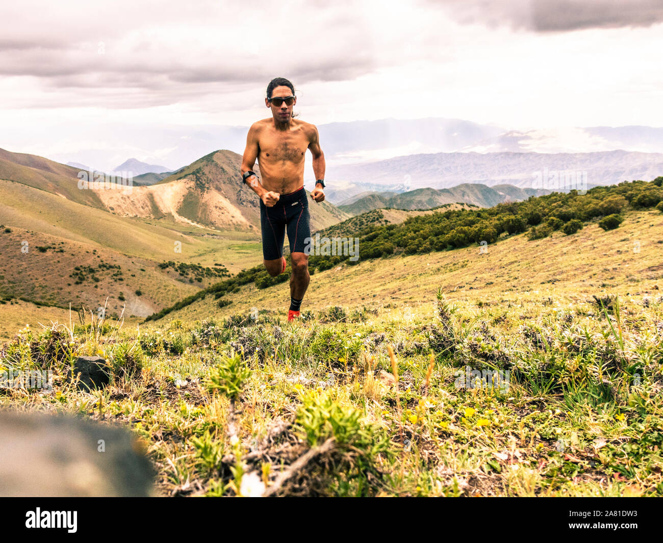 Male trail runner in the Andes Mountains near Potrerillos, Argentina. Stock Photo
