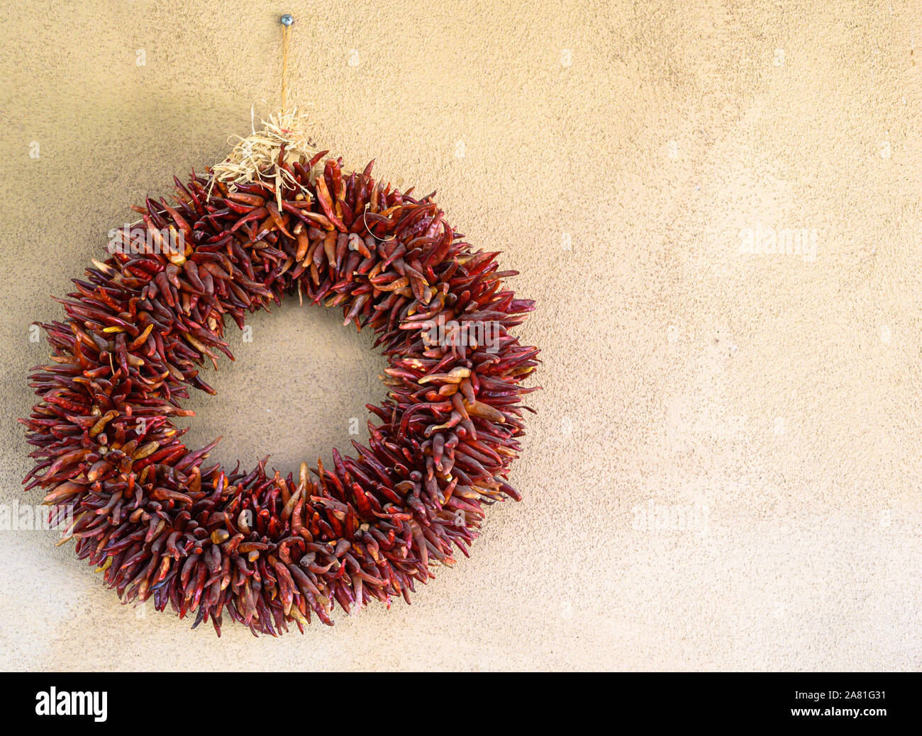 A New Mexico-style wreath made of dried red chiles Stock Photo
