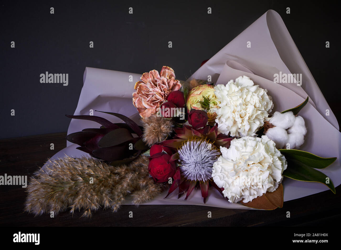 Close-up bouquet decorated in vintage style on a dark background, selective focus Stock Photo