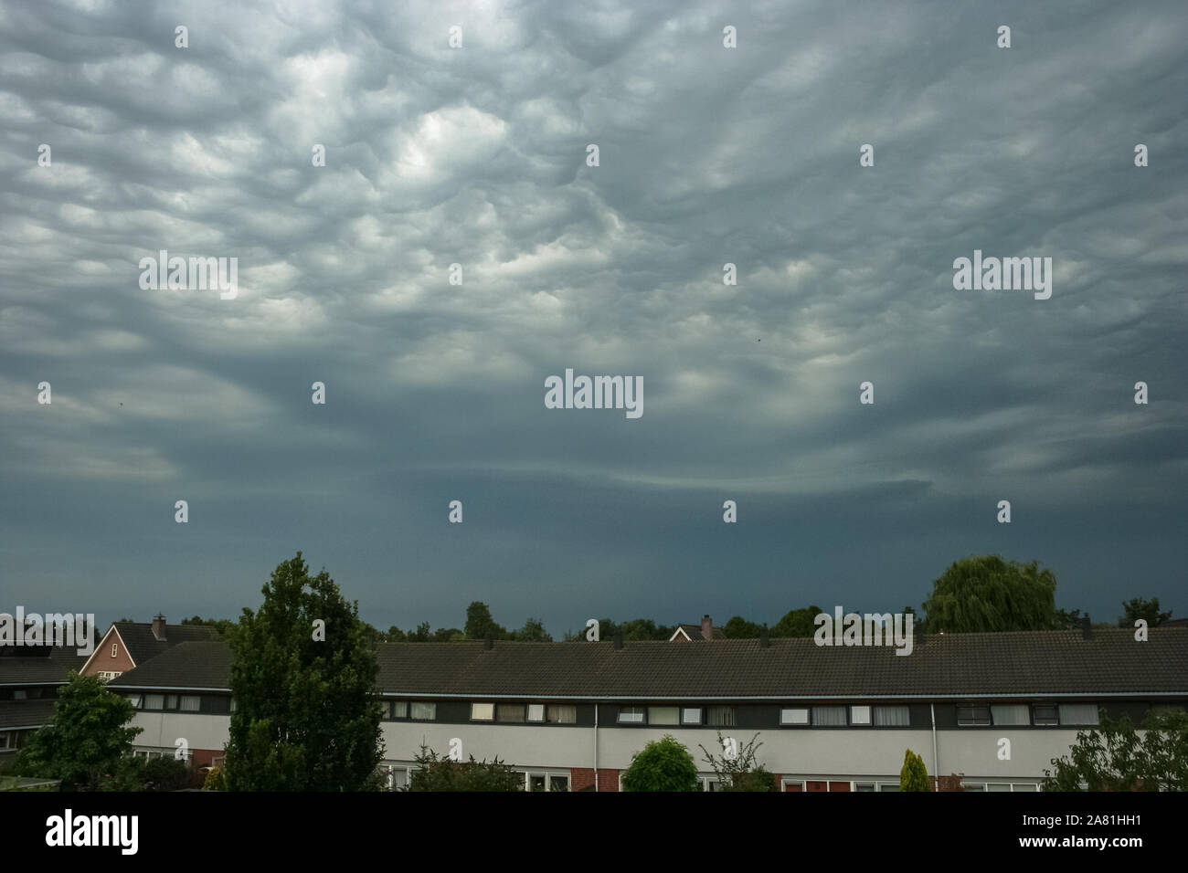 Unusual clouds named Altocumulus undulatus asperitas, or bubble clouds, near Utrecht, Holland. These strange clouds are associated with thunderstorms. Stock Photo