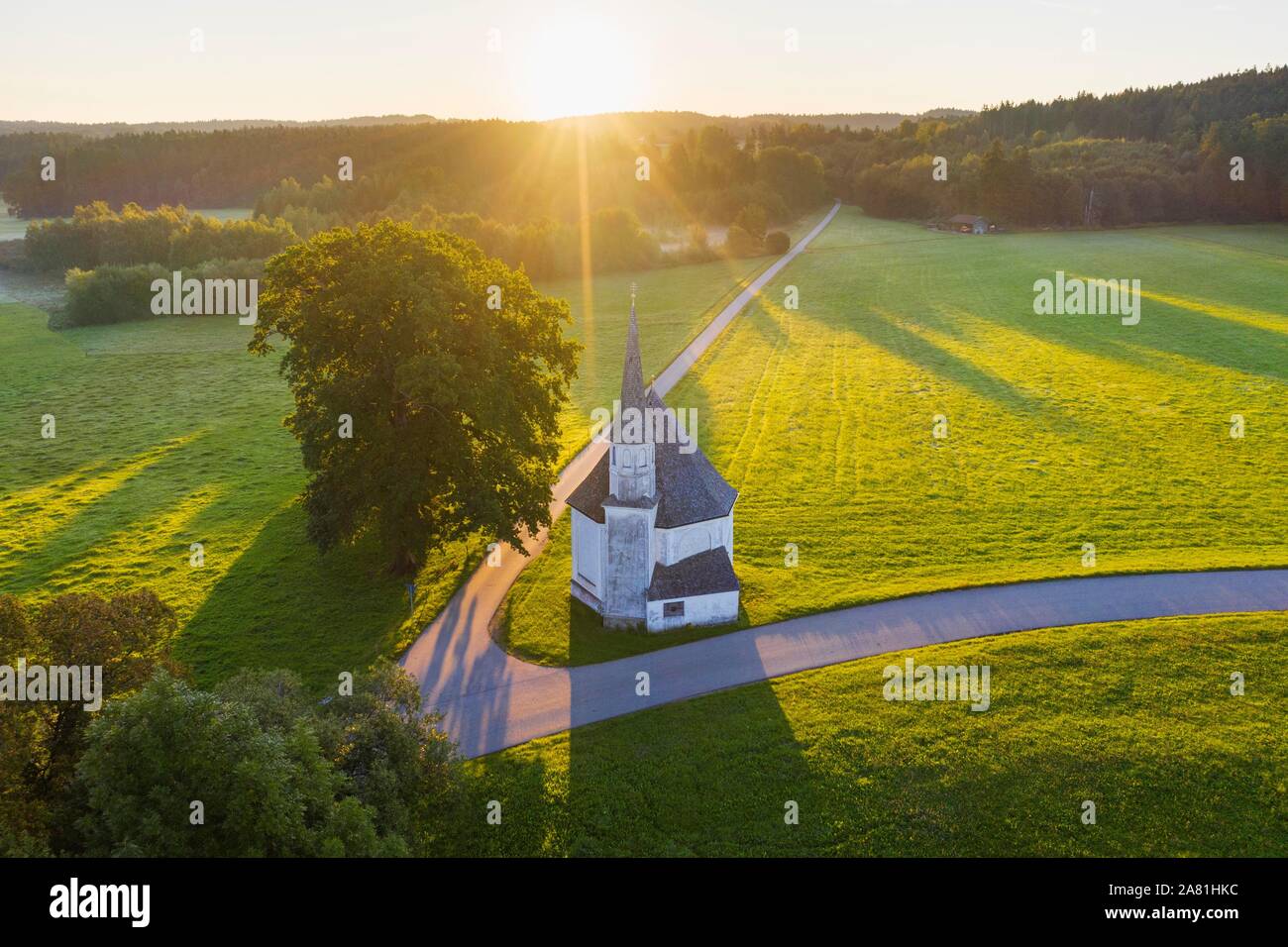 Chapel of St. Leonhard in Harmating at sunrise, near Egling, Tolzer Land, aerial view, Upper Bavaria, Bavaria, Germany Stock Photo