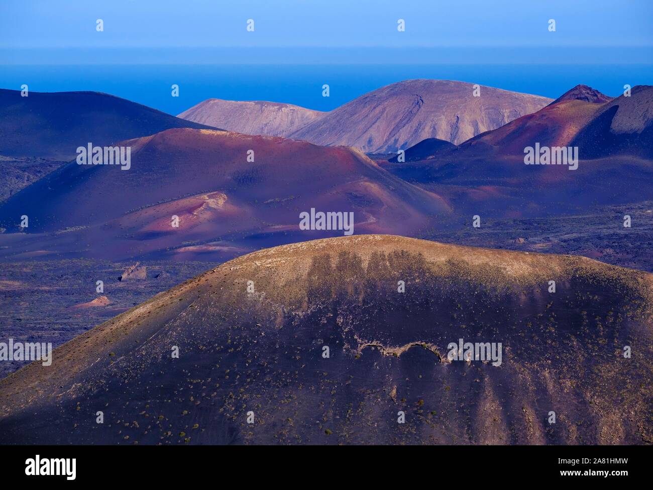 Fire mountains in Timanfaya National Park, view from Montana de Guardilama, Lanzarote, Canary Islands, Spain Stock Photo