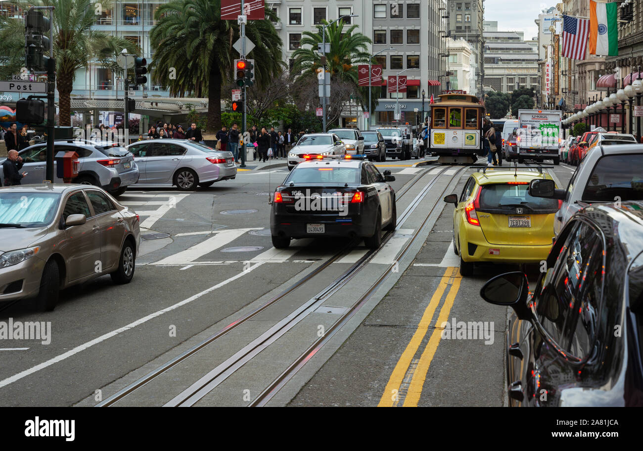 SAN FRANCISCO - February 08, 2019: Cable car on San Francisco streets. It’s the world's last manually operated cable car system and is the icon of the Stock Photo
