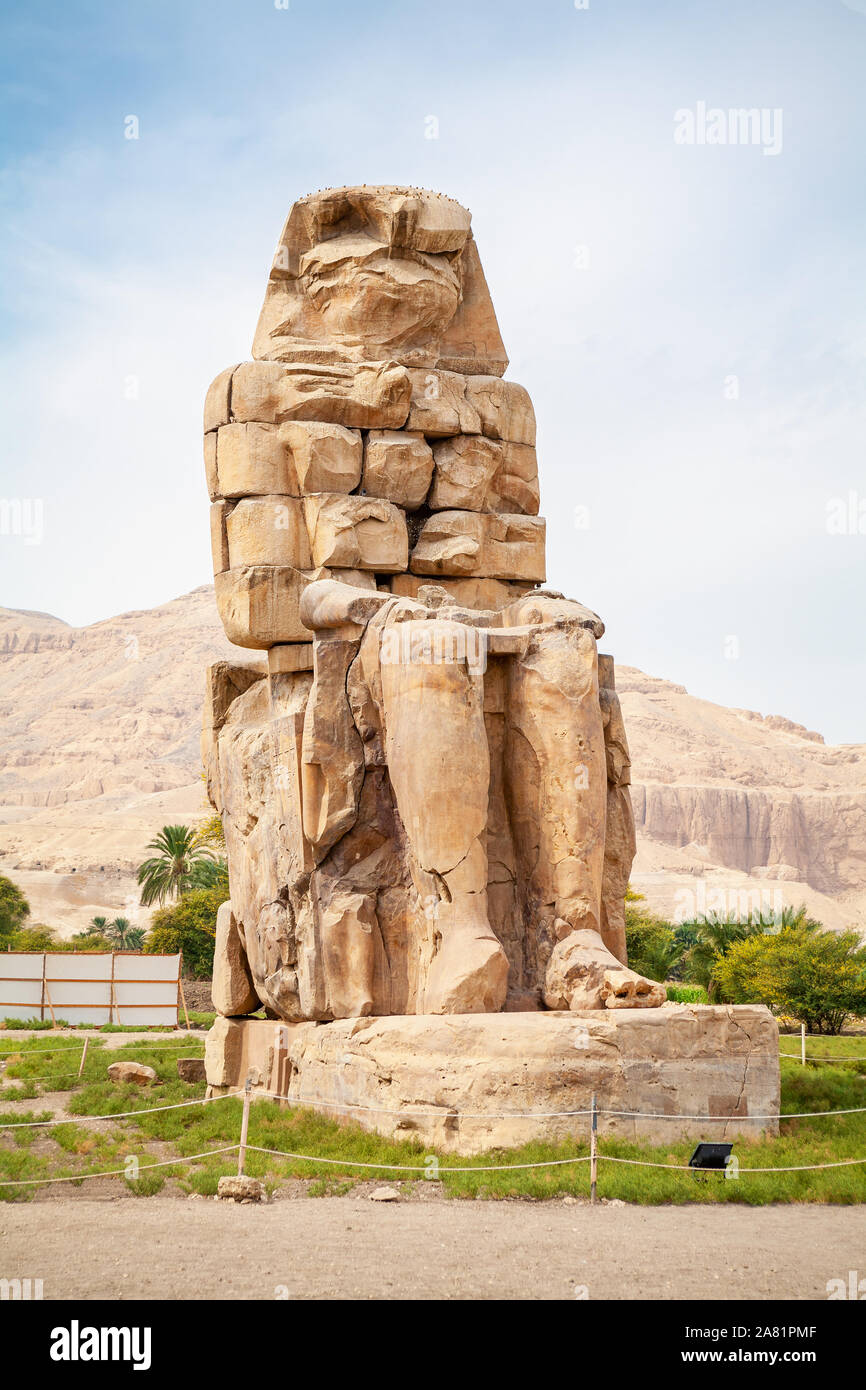 One of the two Colossi of Memnon giant statues of Pharaoh Amenhotep III. Luxor, Egypt Stock Photo