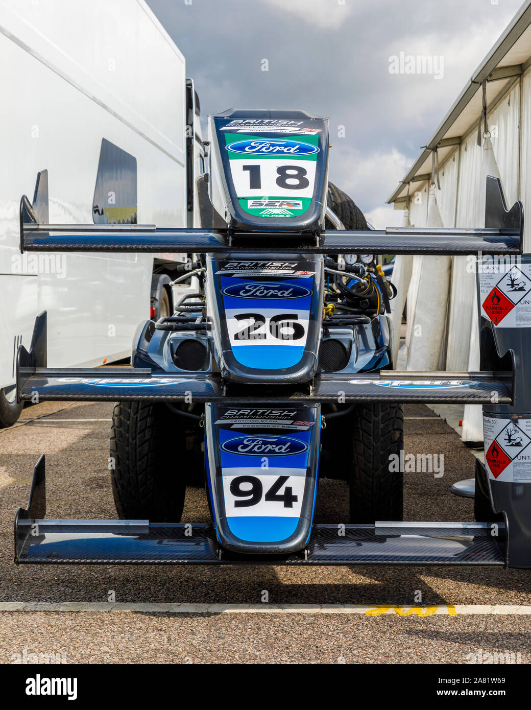 Double R Racing team nose-cones on a rack outside the paddock garage at the 2019 BTCC meeting at Snetterton, Norfolk, UK. Stock Photo