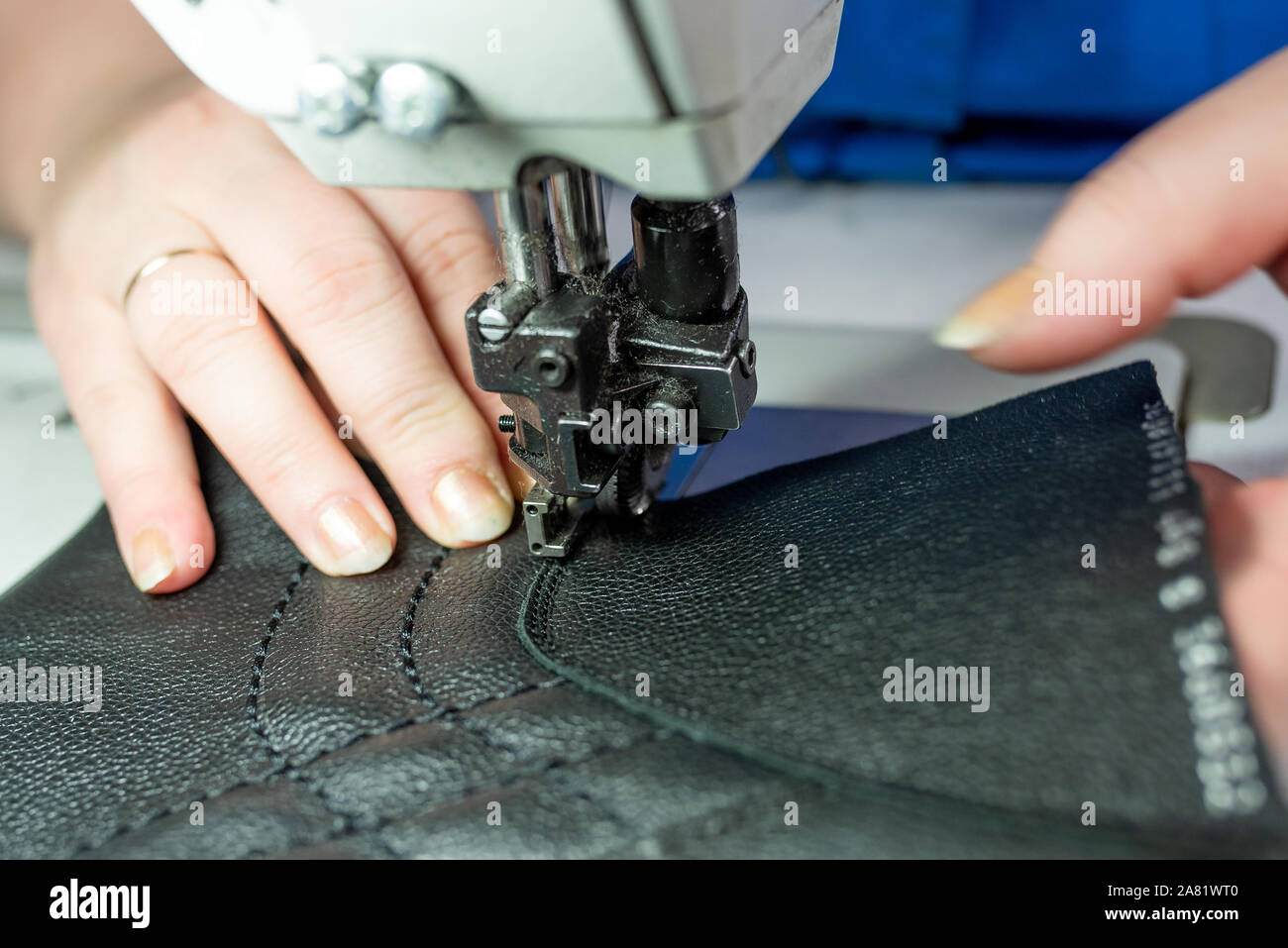 The process of sewing shoes on a sewing machine. Shoe production Stock