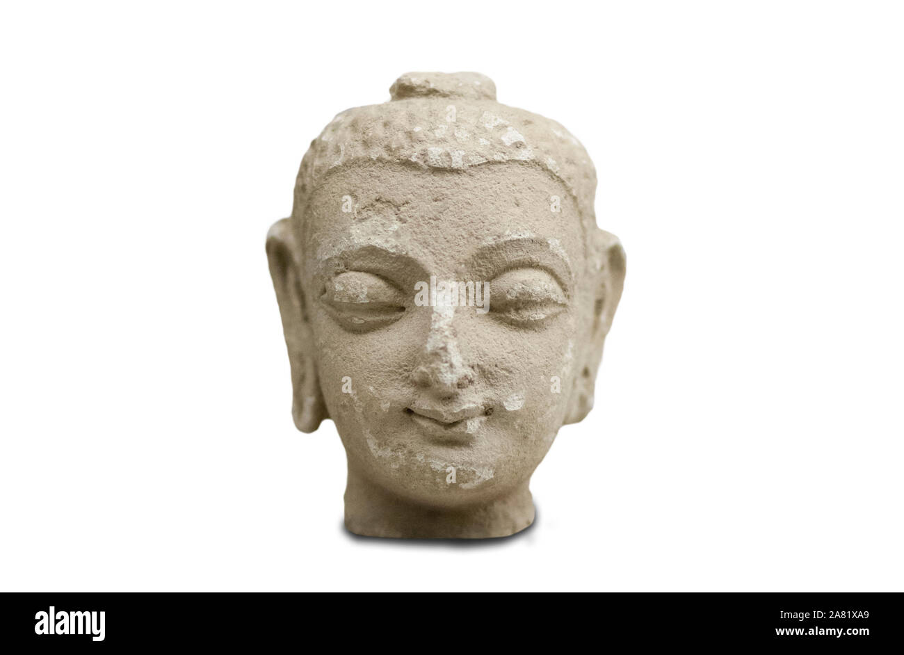 Madrid, Spain - Sept 12th, 2018: Stucco head of buddha figurine from Gandara, northeast Afghanistan. 5th Century AC. National Anthropology Museum, Mad Stock Photo
