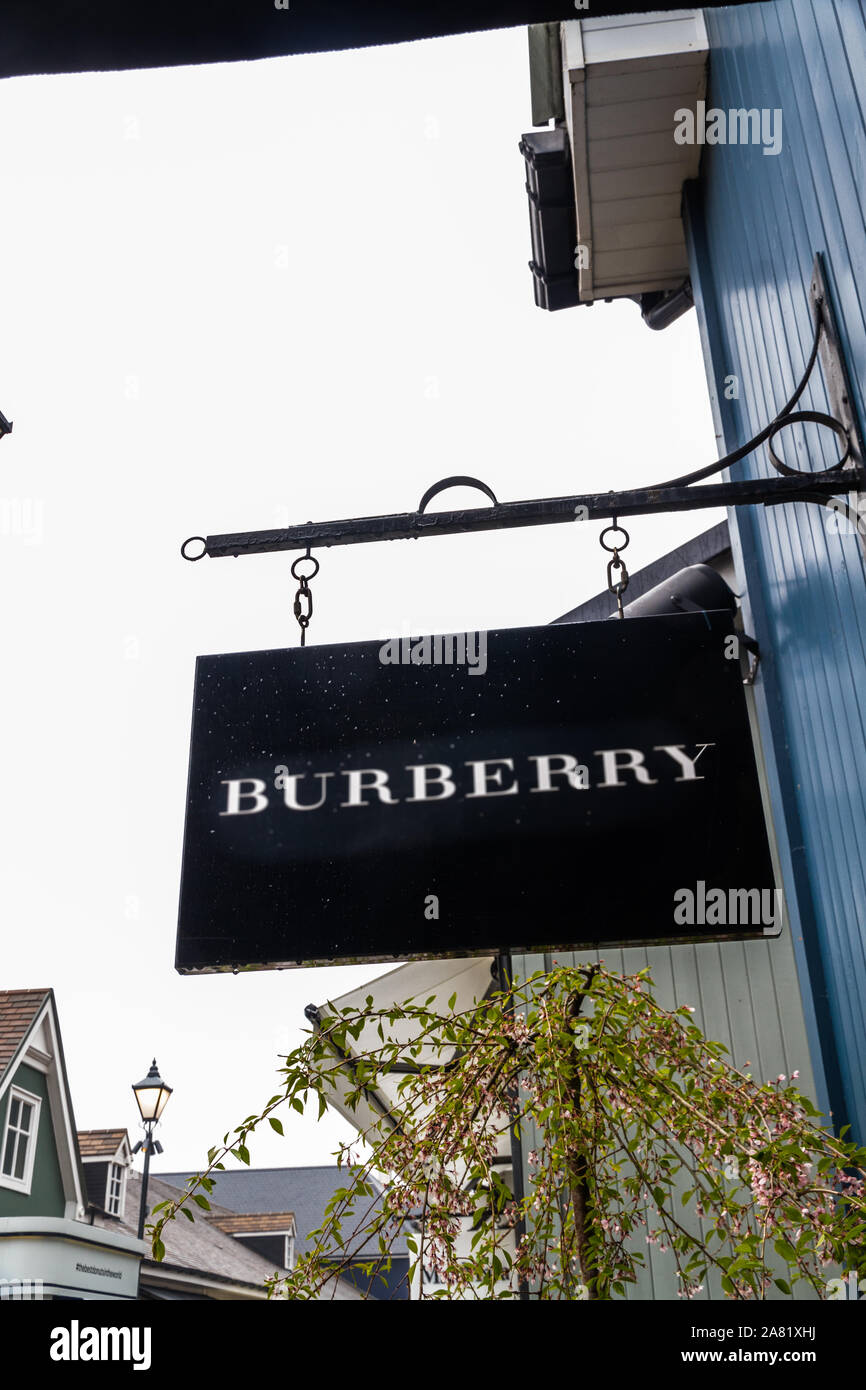 Bicester Village outlet, England , Sign or logo of Burberry on hanging sign  on April 04 2019 in UK Stock Photo - Alamy