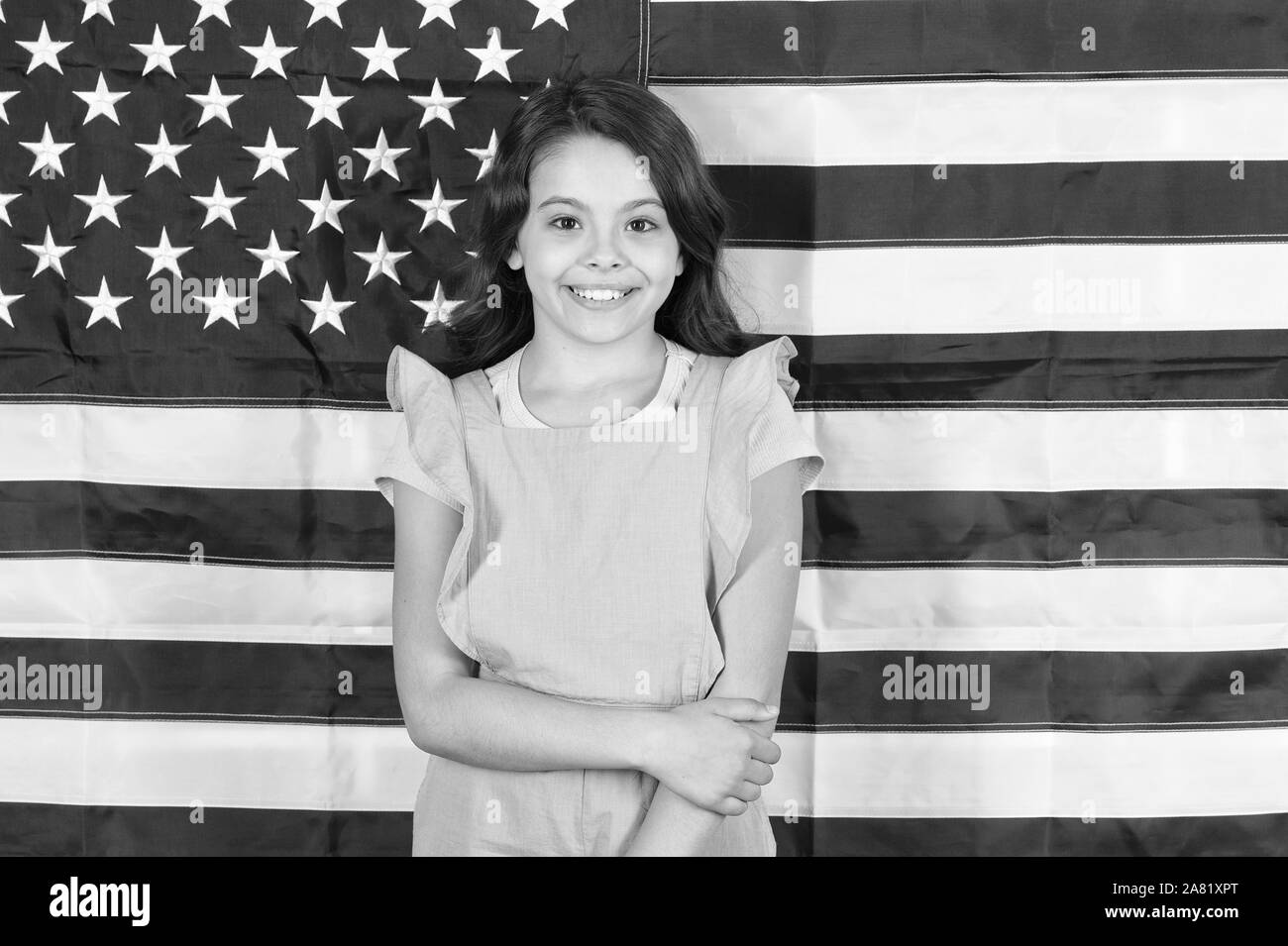 Let freedom reign. Independence is happiness. Independence day holiday. Americans celebrate independence day. Little girl with USA flag. Study english language. Education abroad. Patriotic upbringing. Stock Photo