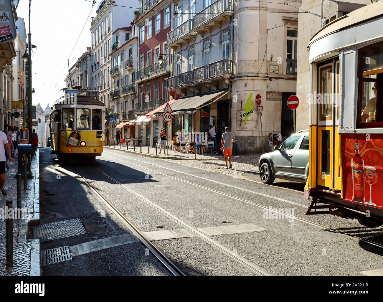 LISBON BAIRRO ALTO, PORTUGAL - AUG 04: Busy lifestyle in the old town of Lisbon with traditional tram , shops and urban life in Bairro Alto district, Stock Photo