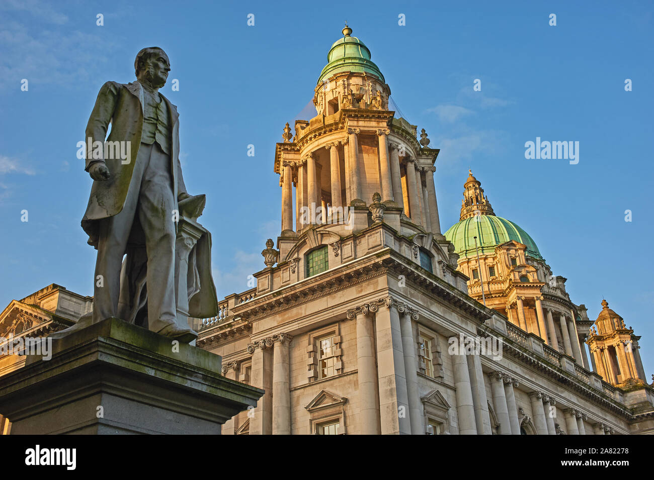 The statue of James Harland, MP for Belfast Norzh, and one part of the Harland and Woolf shipyard, stands outside City Hall in the centre of Belfast Stock Photo