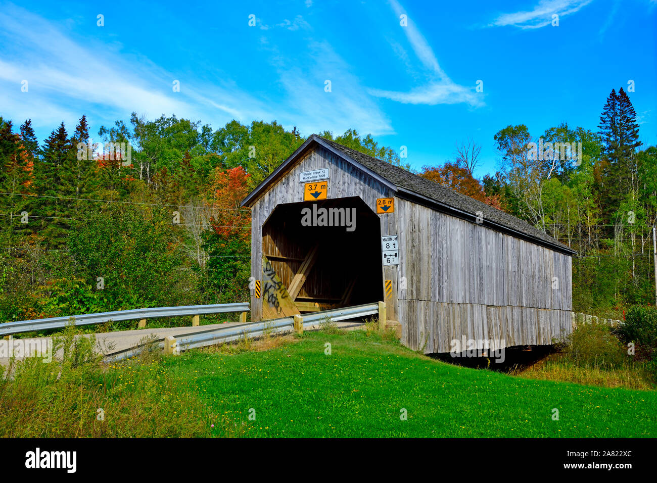 A one lane covered bridge built in 1909 crossing Wards Creek near Sussex New Brunswick Canada Stock Photo