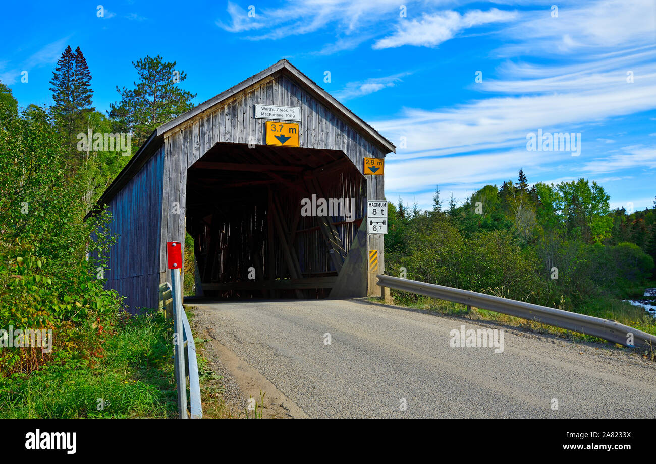 A one lane covered bridge built in 1909 crossing Wards Creek near Sussex New Brunswick Canada Stock Photo