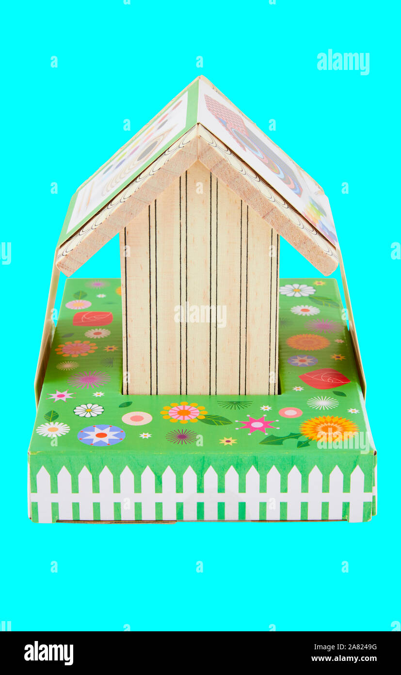 Classic Bird house toy for kids isolated on cyan background with