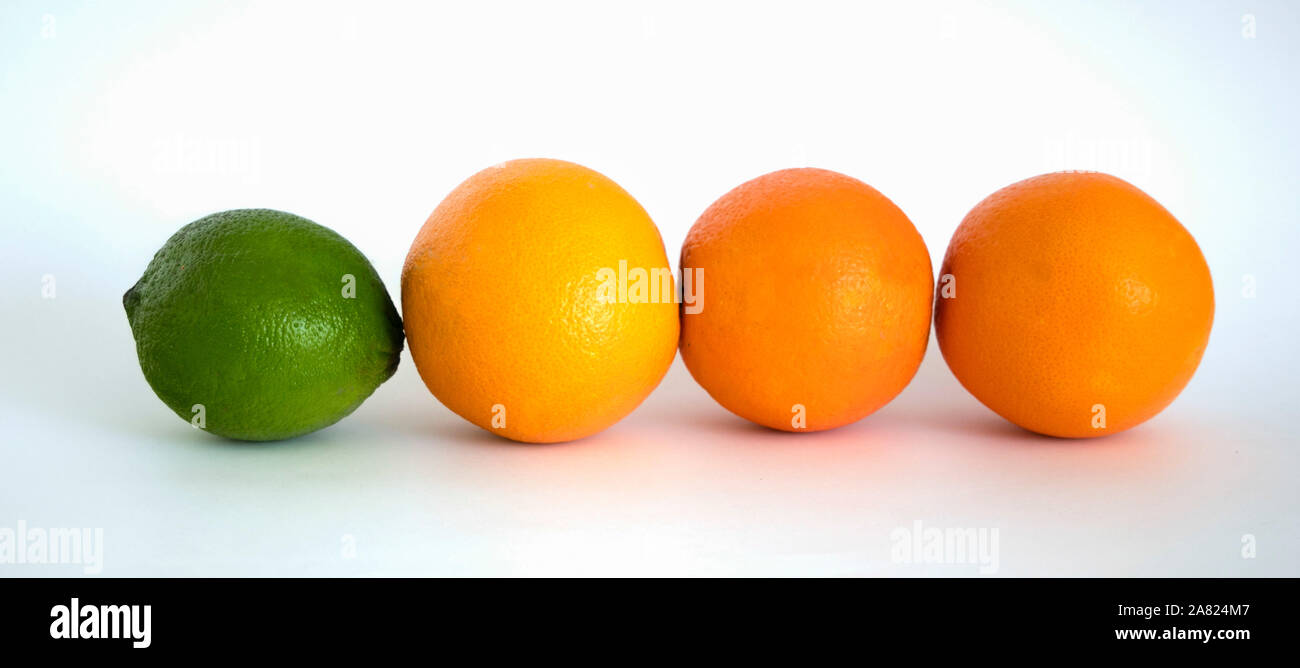 Lime and Oranges - odd one out Stock Photo
