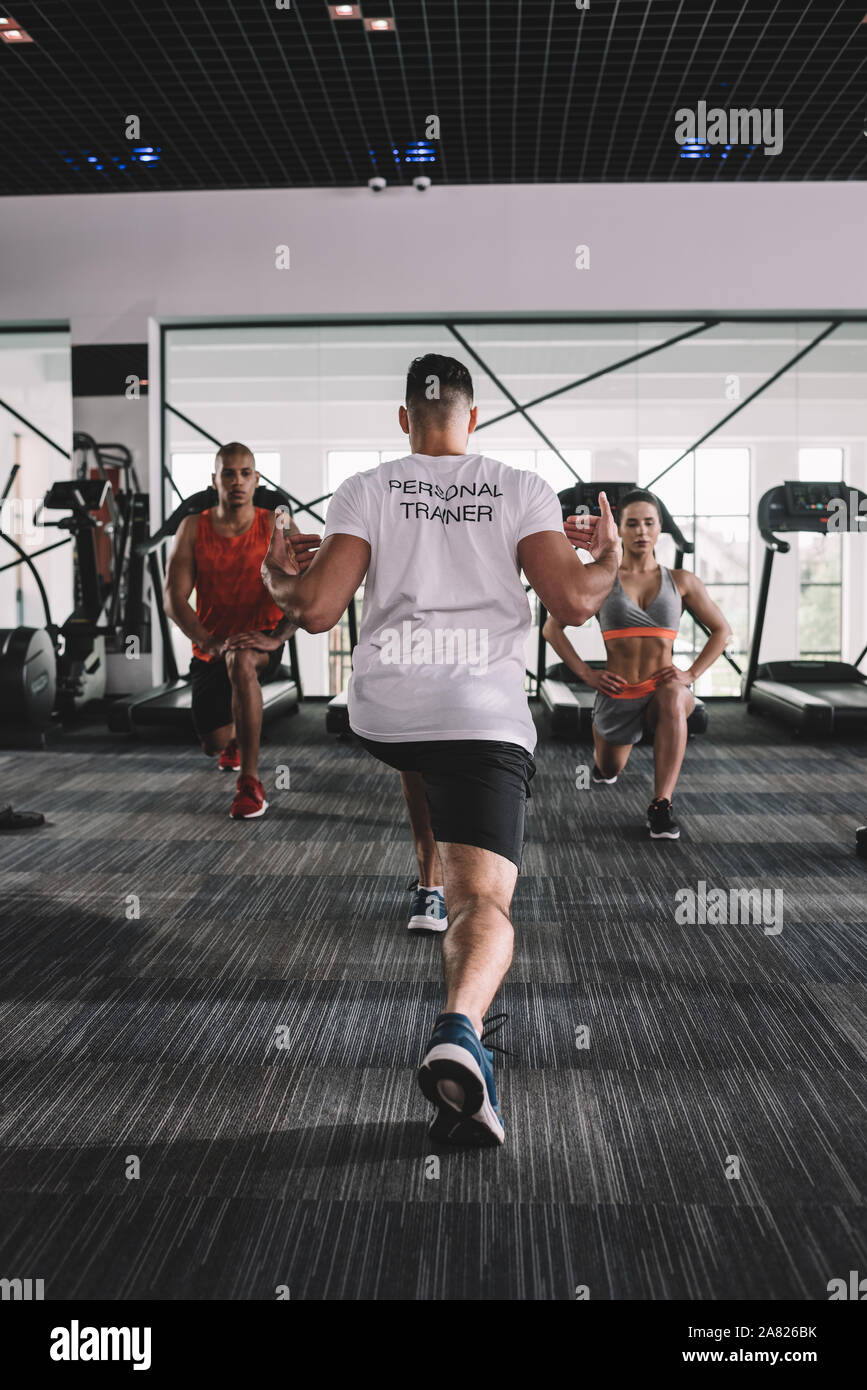 Multiethnic group athletes stretching together hi-res stock photography ...