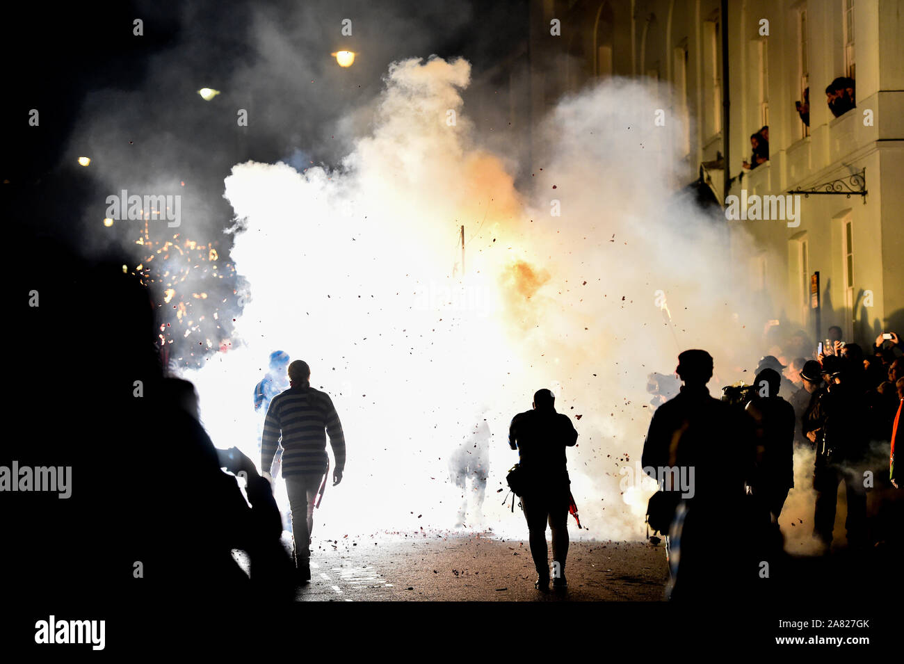 Lewes UK 5th November 2019 - A firework explodes in the street as thousands take part and watch the annual Lewes Bonfire celebrations remembering the failure of the Guy Fawkes gunpowder plot of 1605 .The Lewes Bonfire Night Celebrations are the largest 'Fifth of November' event in the world with the six town bonfire societies taking part and over 30 processions taking place throughout the evening : Credit Simon Dack / Alamy Live News Stock Photo