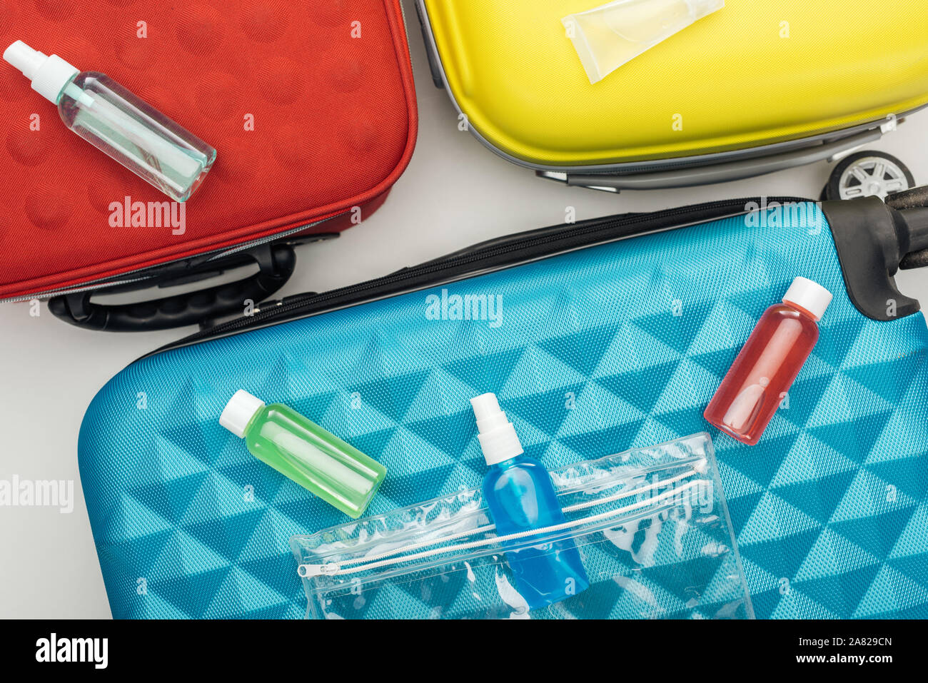 top view of bright bottles with liquids on travel bag Stock Photo Alamy