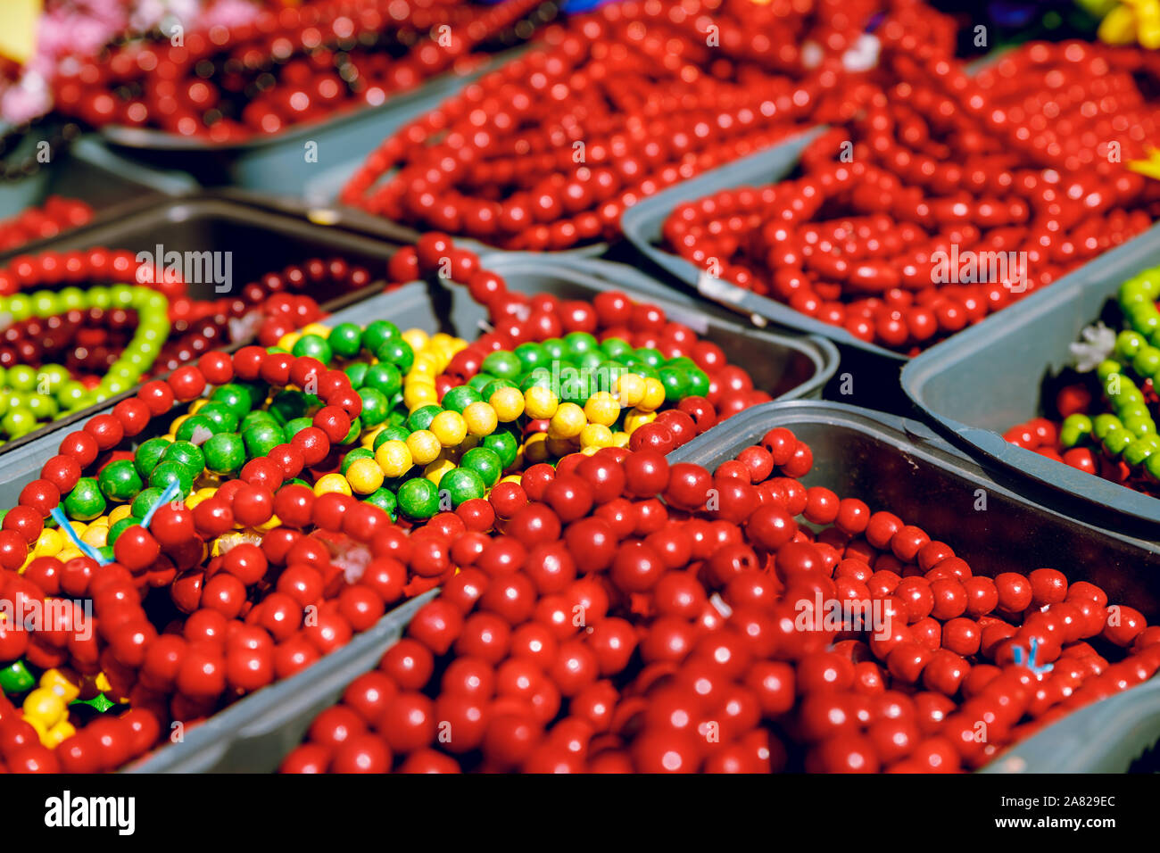 Red beads made of wood. Close-up. Brightly. Stock Photo
