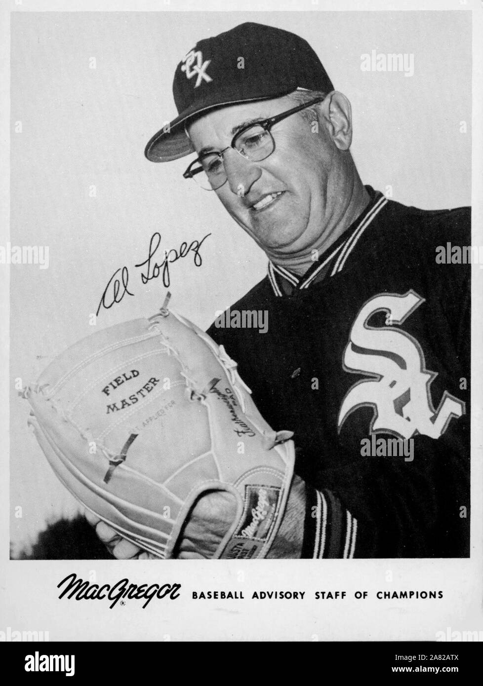 Vintage black and white photo of Major League baseball manager Al Lopez with the Chicago White Sox circa 1960s as endorsement for MacGregor sporting goods and gloves. Stock Photo