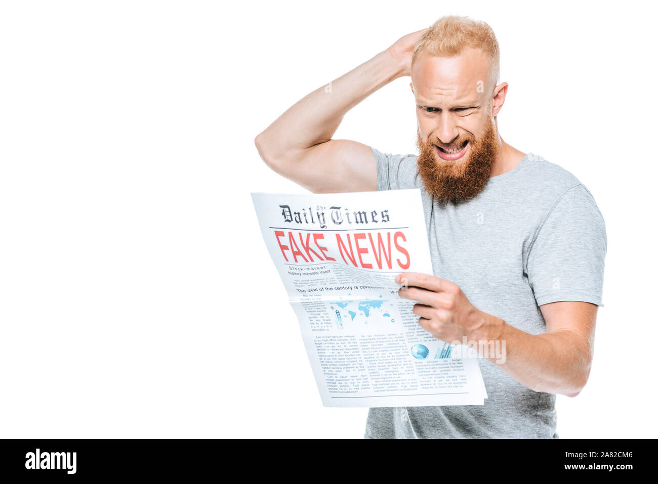 confused bearded man reading newspaper with fake news, isolated on white Stock Photo