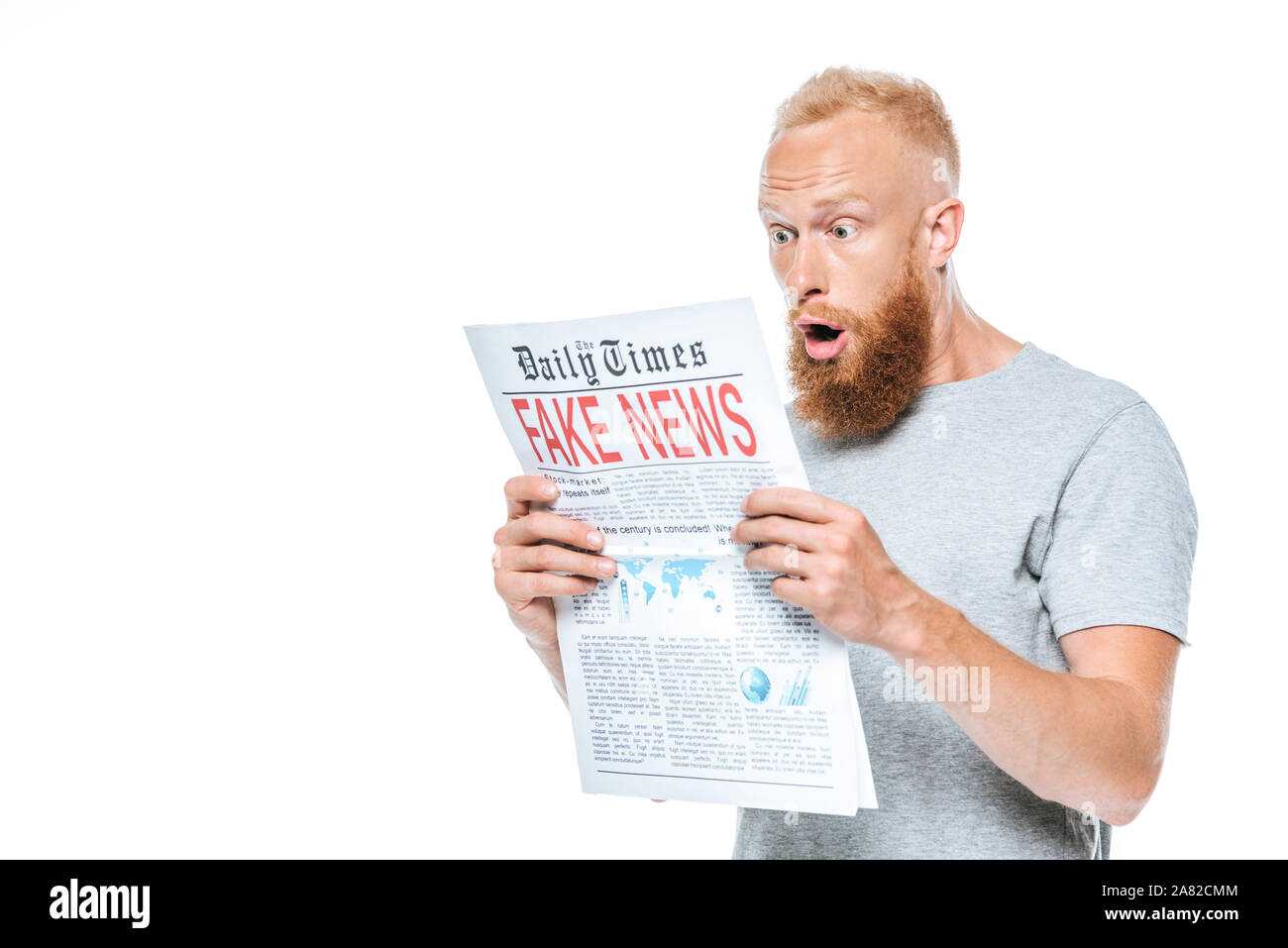shocked bearded man reading newspaper with fake news, isolated on white Stock Photo
