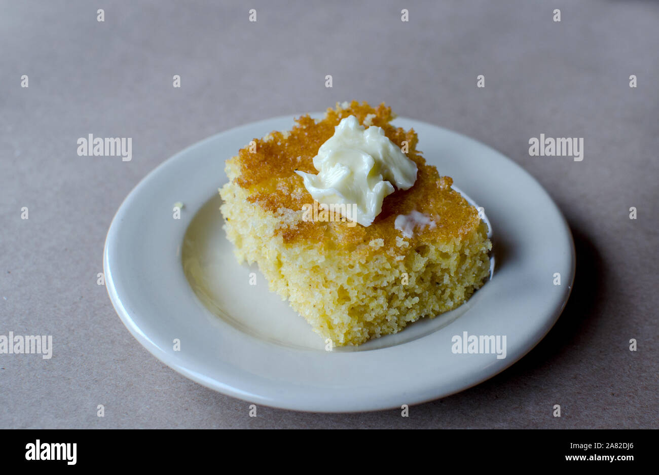 corn bread with a pat of butter Stock Photo