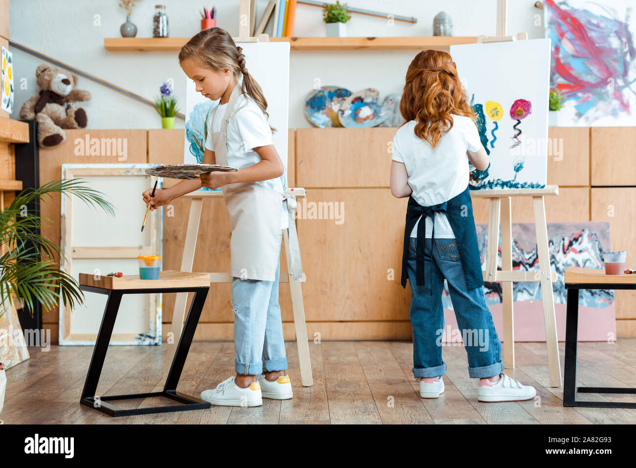 Happy Redhead Kid Painting Canvas Art School Stock Photo by ©AndrewLozovyi  315124082
