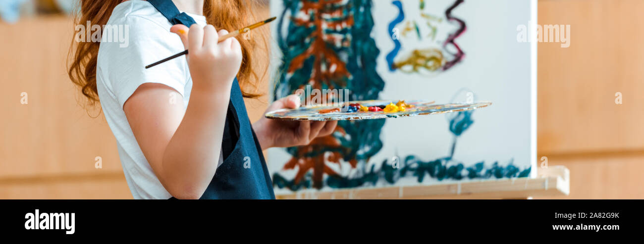 Girl painting on canvas in art class hi-res stock photography and ...
