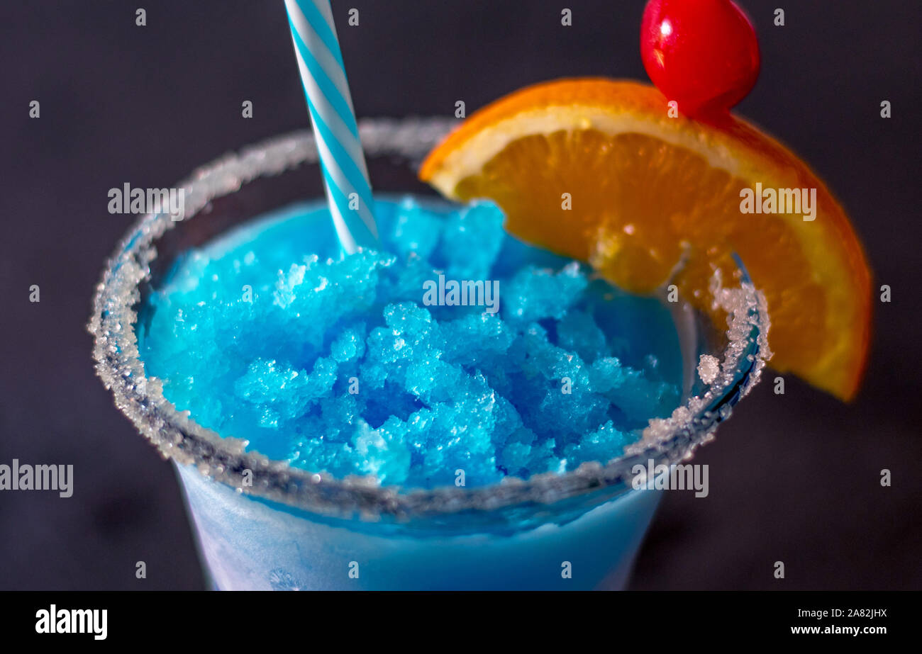 close up of a delicious frozen drink called a blue whale, with ice, lemonade, citrus vodka and curacao blue Stock Photo