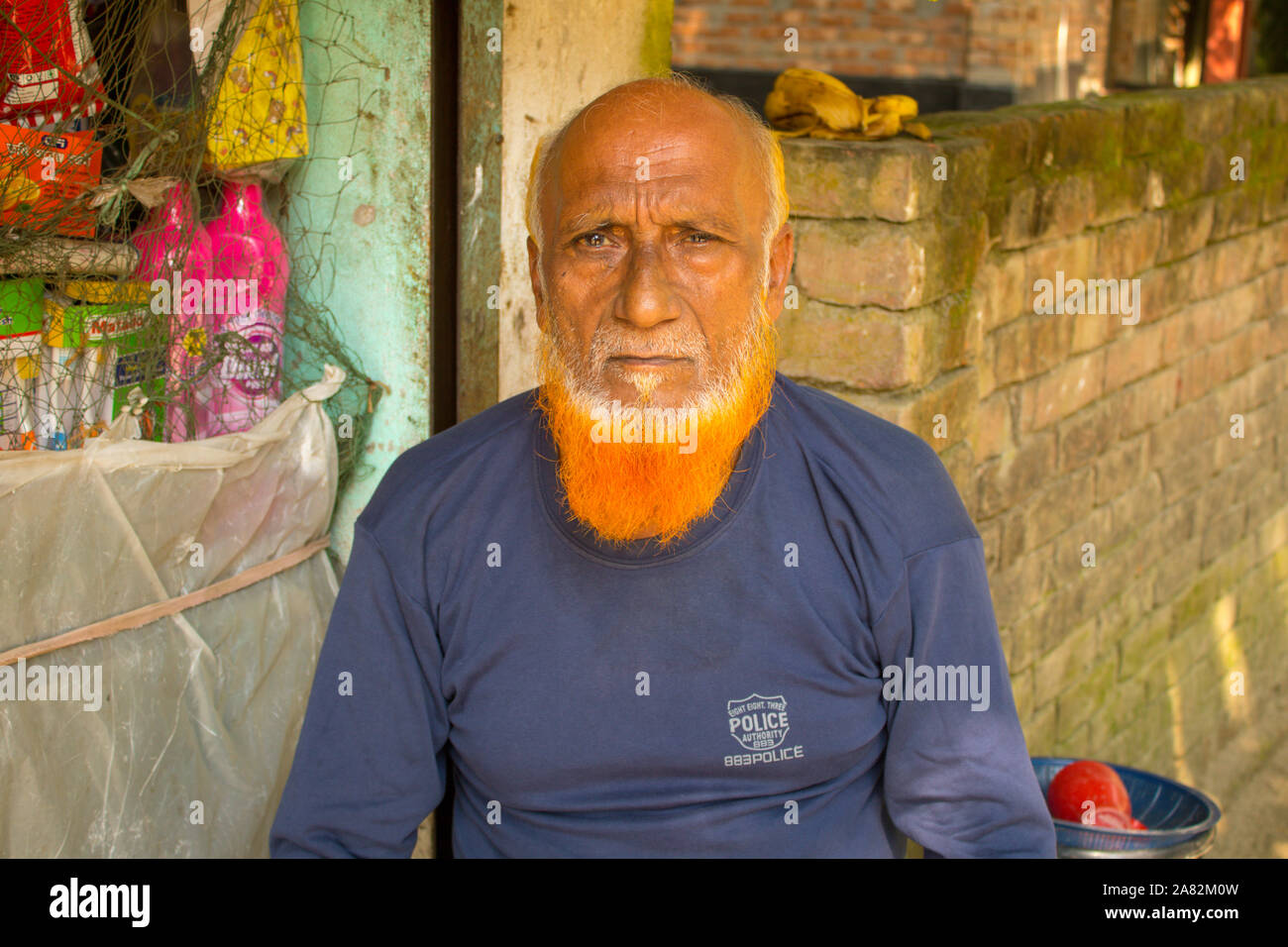 South Asian Old Man With Gray Beard and Bald Head Stock Photo