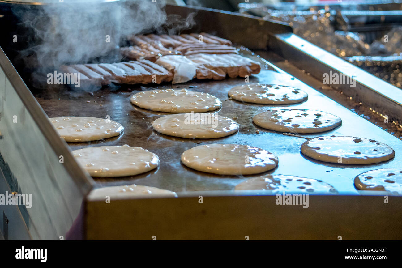 commercial griddle with pancakes and sausage Stock Photo Alamy