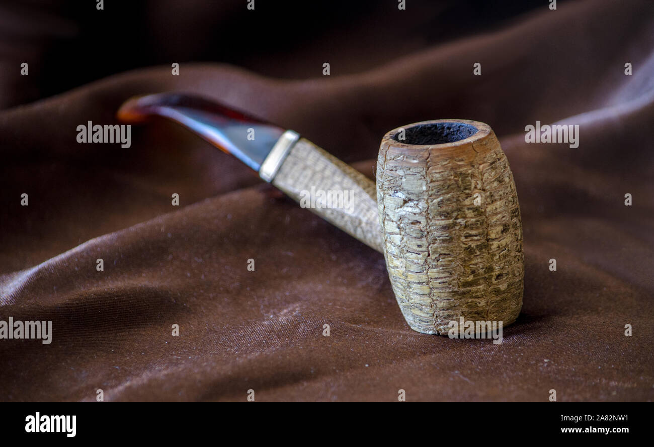 corncob pipe on brown background Stock Photo
