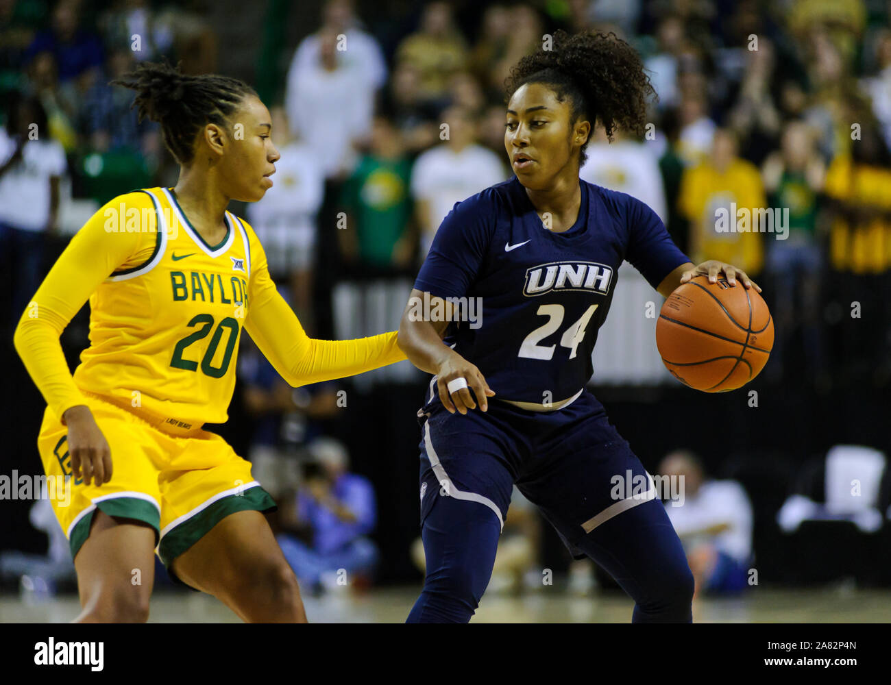 Waco, Texas, USA. 5th Nov, 2019. New Hampshire Wildcats guard Helena Delaruelle (24) dribbles the ball against Baylor Lady Bears guard Juicy Landrum (20) during the 1st half of the NCAA Women's Basketball game between New Hampshire Wildcats and the Baylor Bears at The Ferrell Center in Waco, Texas. Matthew Lynch/CSM/Alamy Live News Stock Photo
