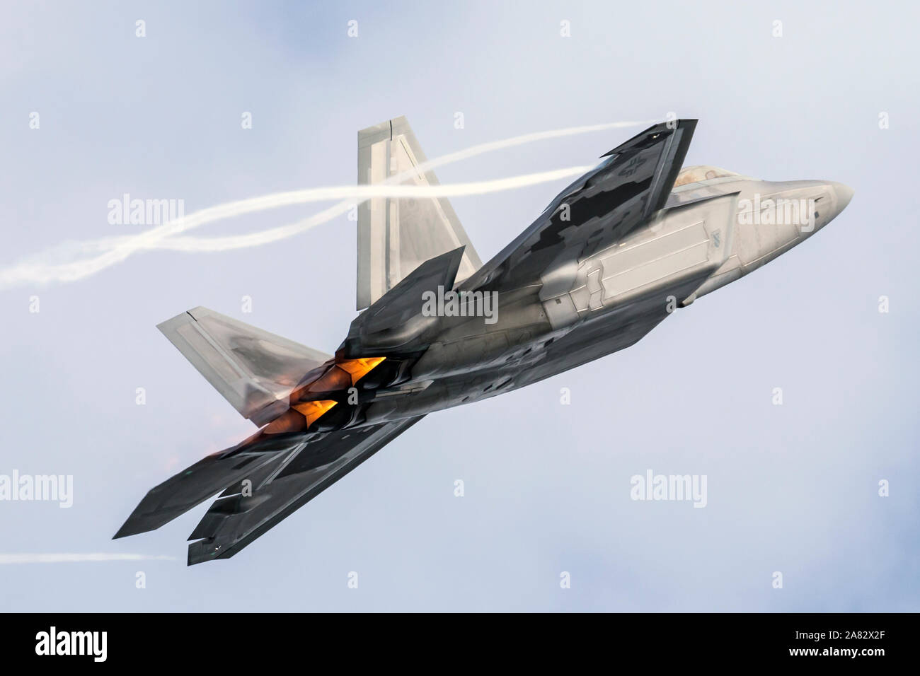 A United States Air Force F-22 Raptor performs at the 2018 Arctic Thunder Airshow. Stock Photo