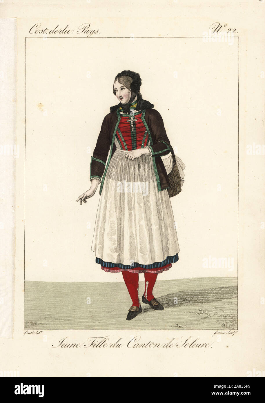 Girl of the Canton of Solothurn, Switzerland, 19th century. She has removed her straw hat to reveal the black velvet toquet. She wears a jacket over laced bodice, apron and many petticoats. Handcoloured copperplate engraving by Georges Jacques Gatine after an illustration by Louis Marie Lante from Costumes of Various Countries, Costumes de Divers Pays, Paris, 1827. Stock Photo