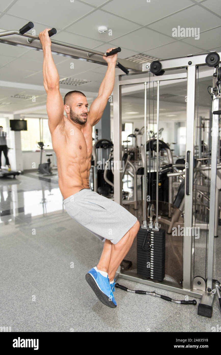 man-performing-hanging-leg-raises-exercise-one-of-the-most-effective