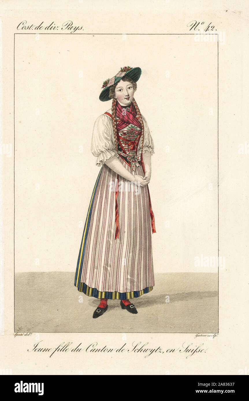 Young single girl of the Canton of Schwyz, Switzerland, 19th century. She wears a hat with ribbons, plaited hair tied with long ribbons, laced bodice, chemise, embroidered bib, striped apron and petticoat. Handcoloured copperplate engraving by Georges Jacques Gatine after an illustration by Louis Marie Lante from Costumes of Various Countries, Costumes de Divers Pays, Paris, 1827. Stock Photo