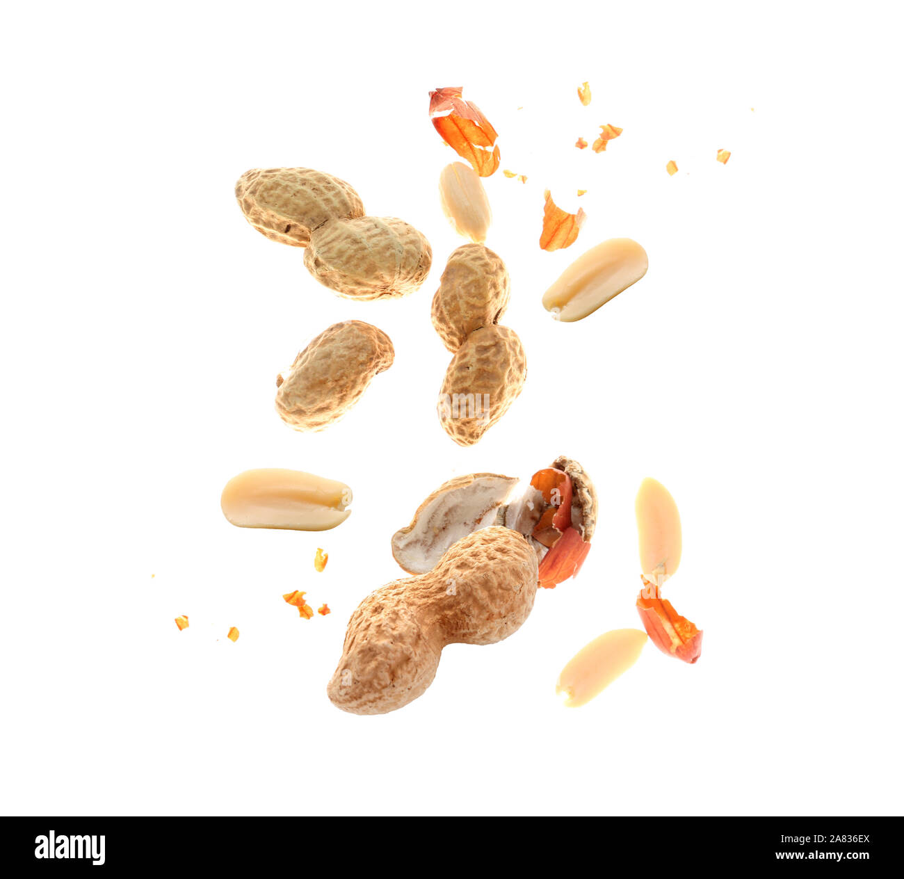 Falling peanuts on white background Stock Photo