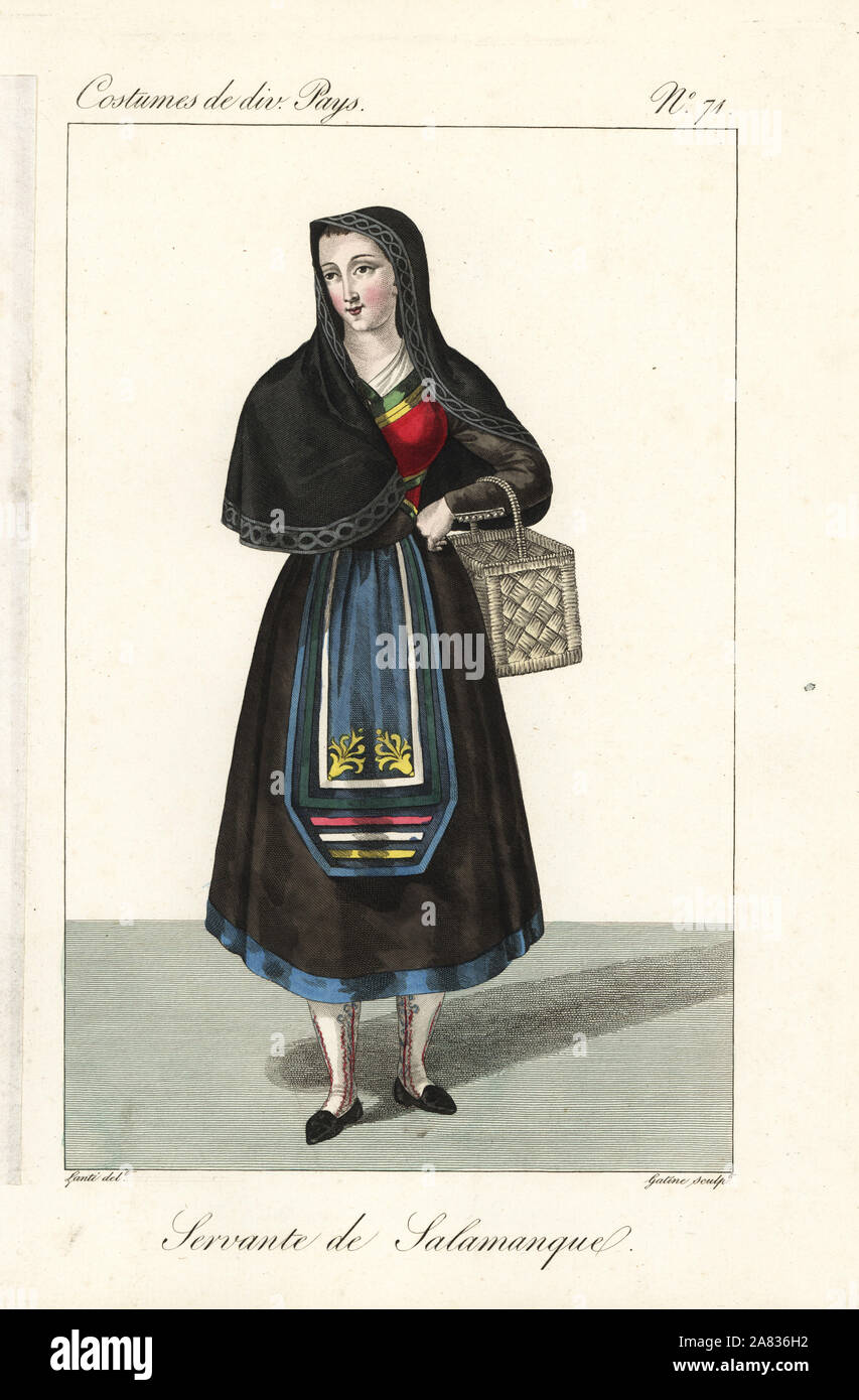 Servant woman of Salamanca, Spain, 19th century. She wears a black shawl, dress with tight bodice, full calf-length skirts, and a narrow decorated apron. Handcoloured copperplate engraving by Georges Jacques Gatine after an illustration by Louis Marie Lante from Costumes of Various Countries, Costumes de Divers Pays, Paris, 1827. Stock Photo