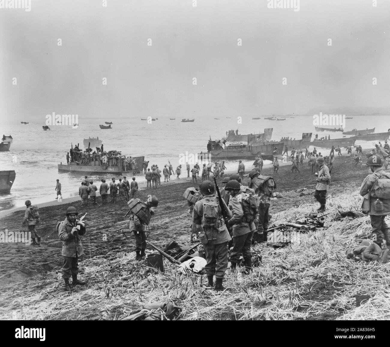 Attu, Aleutian Islands. Landing boats pouring soldiers and their equipment onto the beach at Massacre Bay. This is the Southern landing force. May 11, 1943 Stock Photo