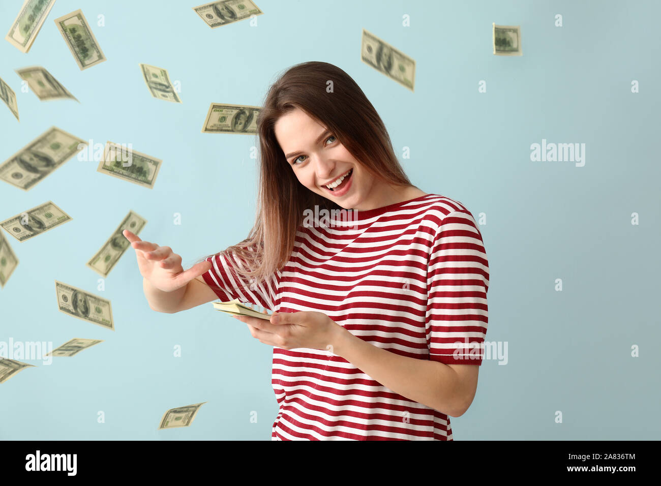 Woman throwing money hires stock photography and images Alamy