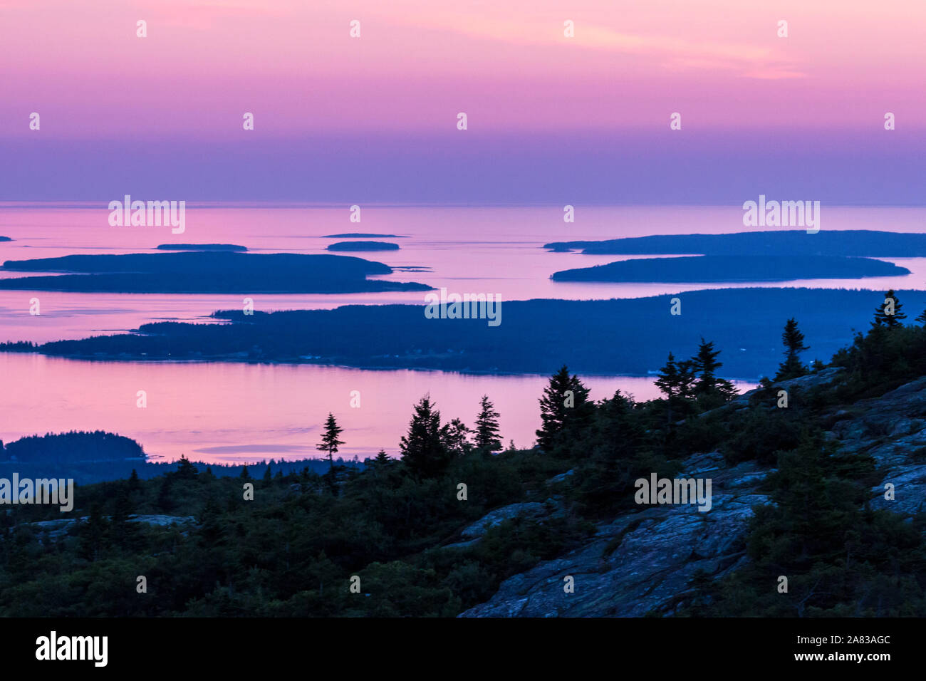 A landscape view from the top of Cadillac Mountain during sunset in