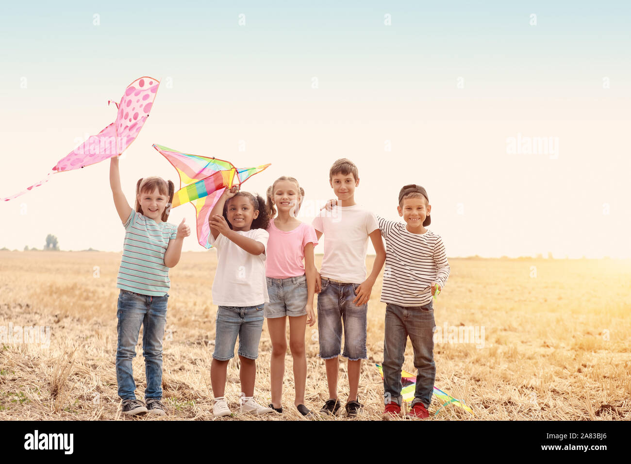 Little children flying kites outdoors Stock Photo - Alamy