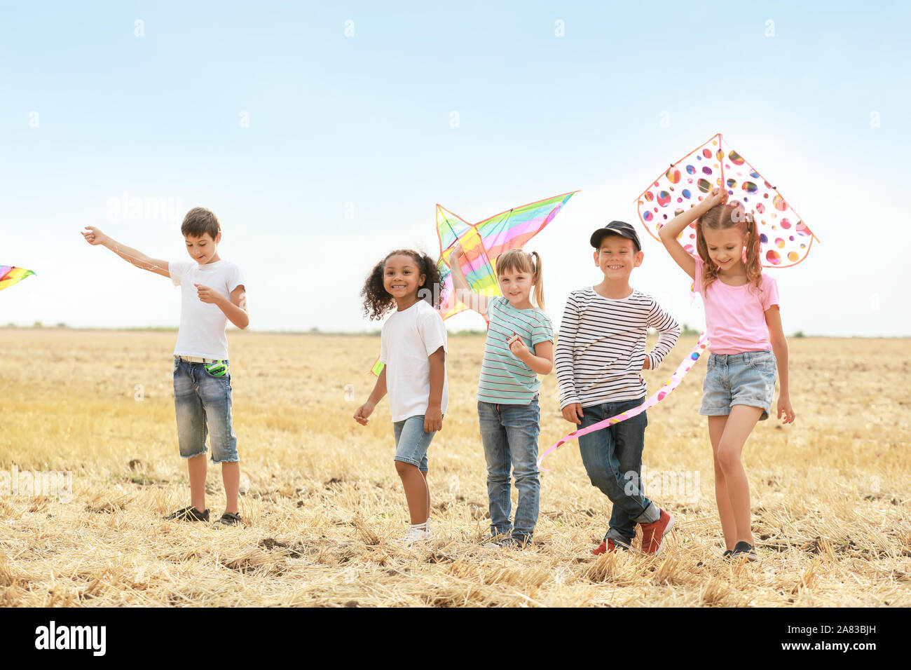 Little children flying kites outdoors Stock Photo - Alamy