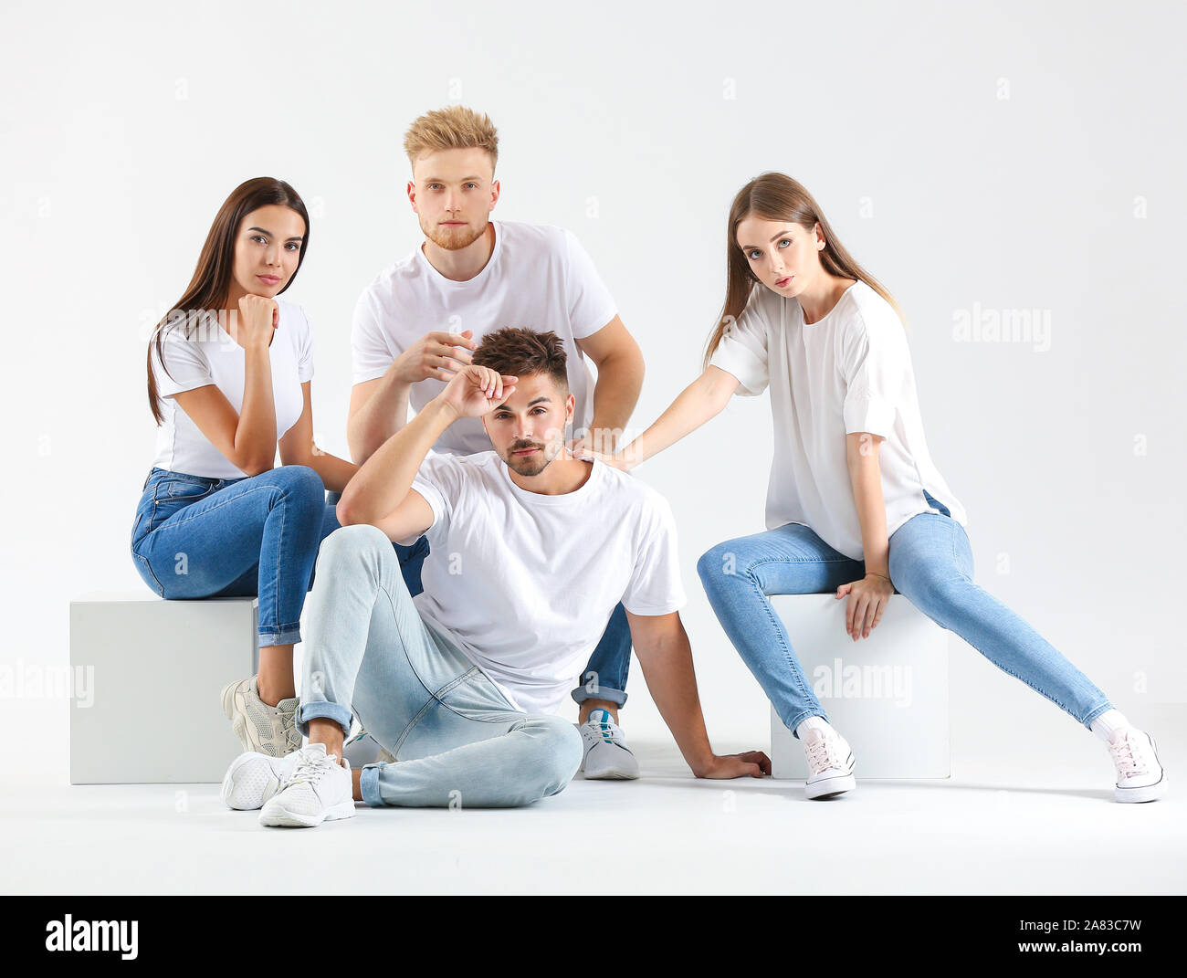 Group of young people in stylish casual clothes on white background ...