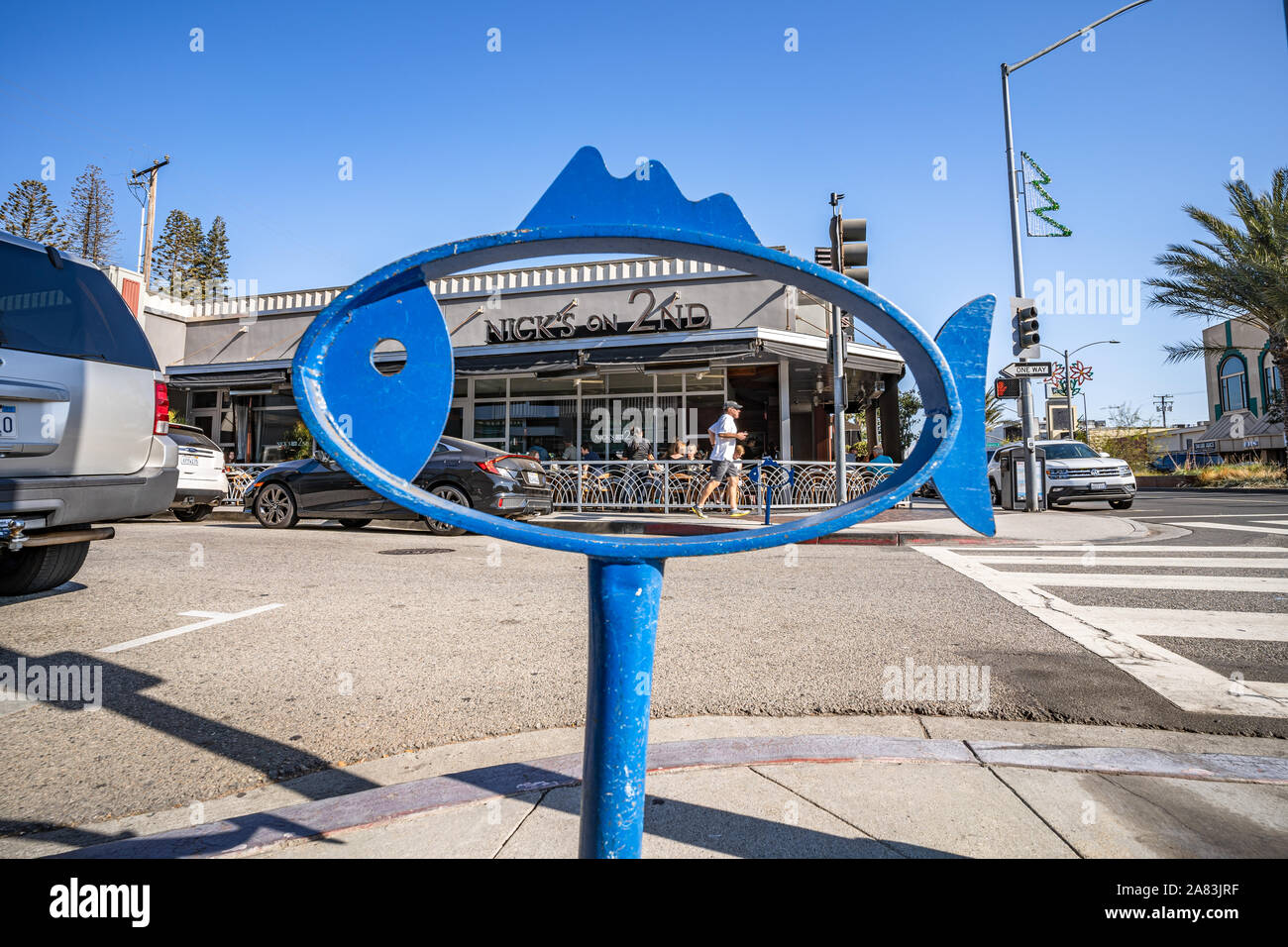Nick s on 2nd restaurant seen through fish shaped bike rack on second