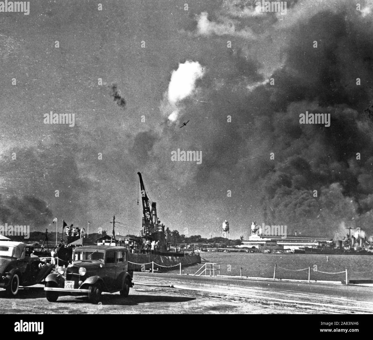 Japanese planes in action over Pearl Harbor, Dec. 7 1941. The USS Narwhal (SS167) in foreground was not hit. Stock Photo